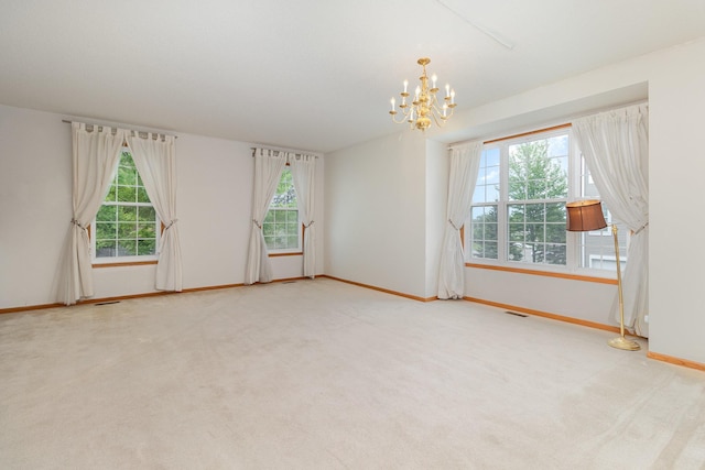 7710 Elm Grove Ct, New Hope, MN 55428 - carpeted spare room featuring a chandelier and healthy amount of natural light