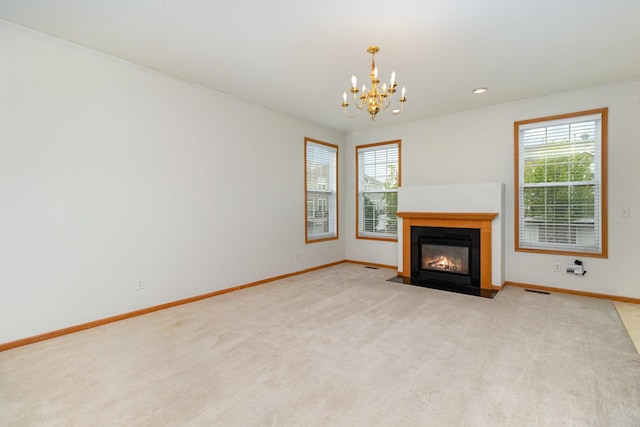 7710 Elm Grove Ct, New Hope, MN 55428 - unfurnished living room with a chandelier, a fireplace with flush hearth, light colored carpet, and recessed lighting