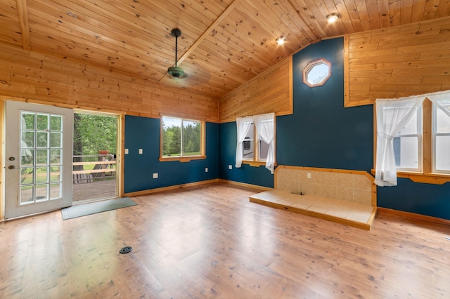 4767 Mccomber Rd, Duluth, MN 55803 - unfurnished living room featuring wooden ceiling, lofted ceiling, wood walls, and wood finished floors