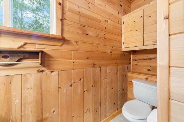 4767 Mccomber Rd, Duluth, MN 55803 - bathroom featuring wooden walls and toilet