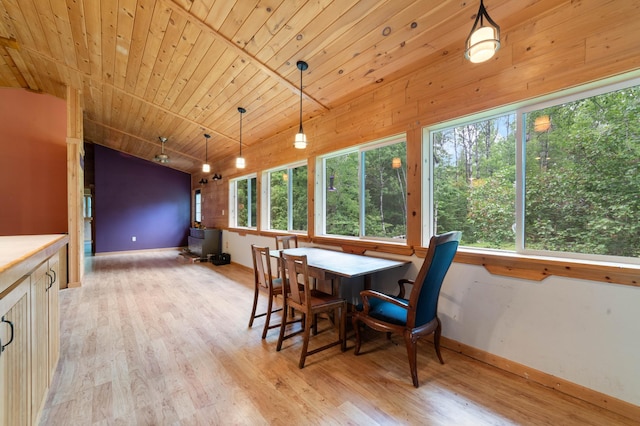 4767 Mccomber Rd, Duluth, MN 55803 - dining space featuring vaulted ceiling, light wood-style floors, and wood ceiling