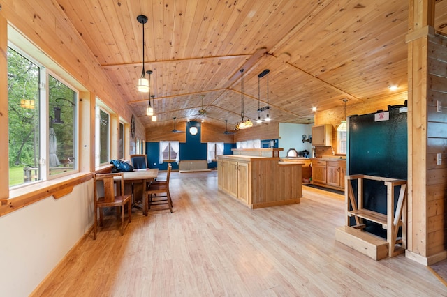 4767 Mccomber Rd, Duluth, MN 55803 - kitchen featuring light wood-style flooring, wood ceiling, open floor plan, a center island, and lofted ceiling