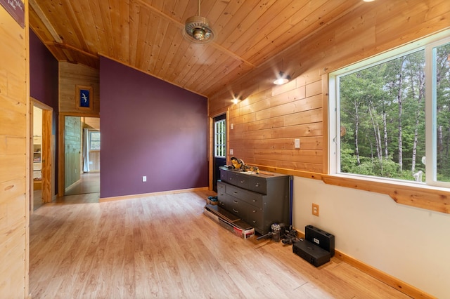 4767 Mccomber Rd, Duluth, MN 55803 - unfurnished living room featuring wood walls, wood finished floors, vaulted ceiling, and wood ceiling