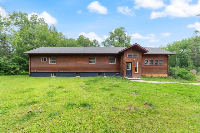 4767 Mccomber Rd, Duluth, MN 55803 - rustic home featuring a front lawn and entry steps