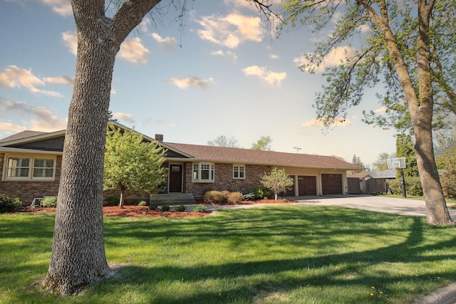 701 Oak Ave, Olivia, MN 56277 - ranch-style house with a garage, driveway, a front lawn, a chimney, and brick siding