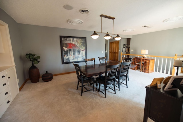701 Oak Ave, Olivia, MN 56277 - dining area with light colored carpet and baseboards