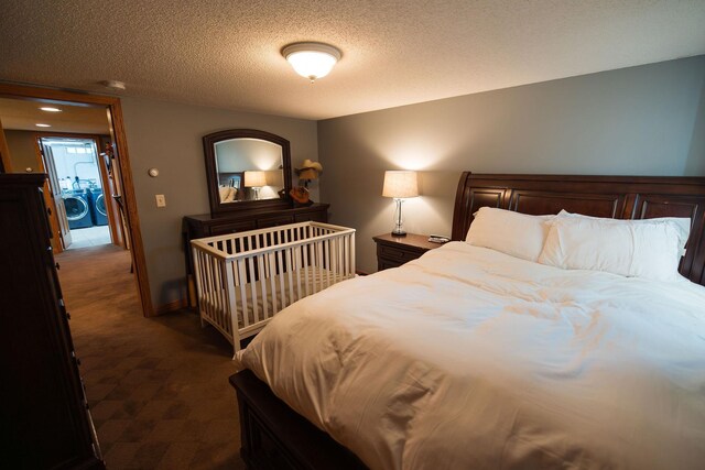 701 Oak Ave, Olivia, MN 56277 - bedroom featuring dark colored carpet, washer / clothes dryer, and a textured ceiling