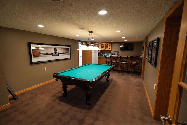 701 Oak Ave, Olivia, MN 56277 - game room with dark carpet, a dry bar, billiards, recessed lighting, and a textured ceiling