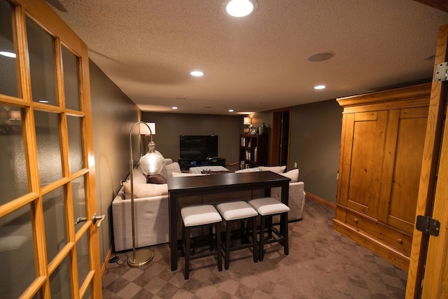 701 Oak Ave, Olivia, MN 56277 - bar featuring recessed lighting, a textured ceiling, and carpet flooring