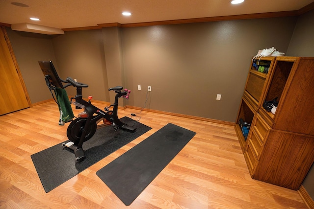 701 Oak Ave, Olivia, MN 56277 - workout room featuring recessed lighting and wood finished floors