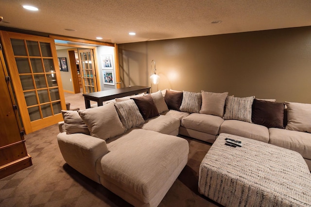 701 Oak Ave, Olivia, MN 56277 - home theater room featuring recessed lighting, carpet, and a textured ceiling
