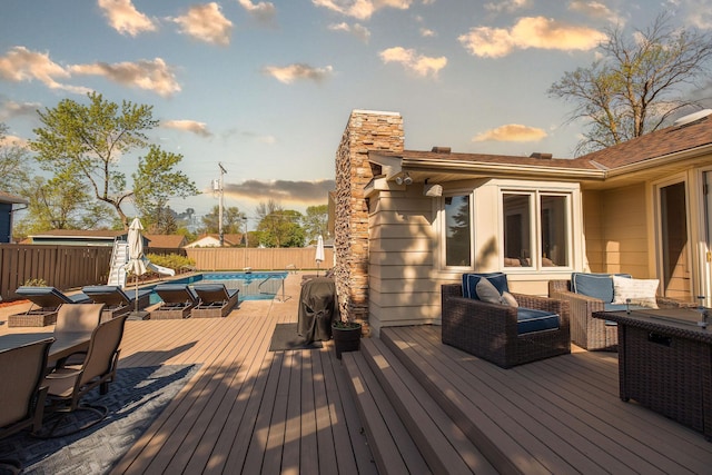 701 Oak Ave, Olivia, MN 56277 - deck with a fenced backyard and outdoor dining space