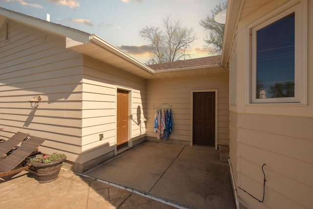 701 Oak Ave, Olivia, MN 56277 - doorway to property with a patio area