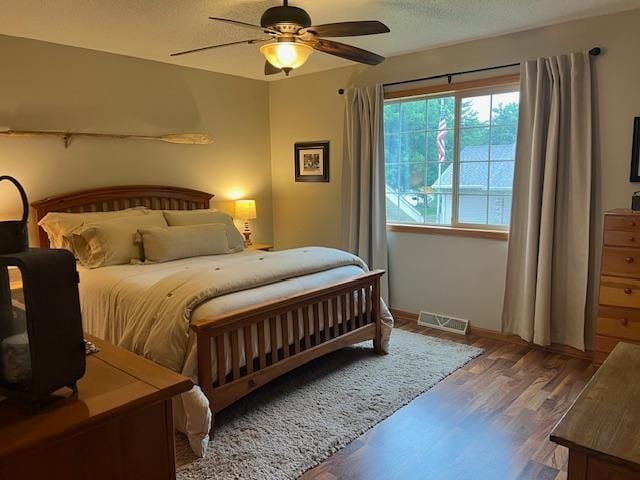 302 Peifer Dr, Litchfield, MN 55355 - bedroom featuring wood finished floors and a ceiling fan