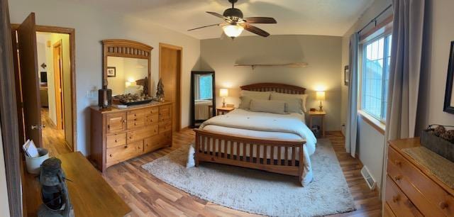 302 Peifer Dr, Litchfield, MN 55355 - bedroom with wood finished floors and a ceiling fan