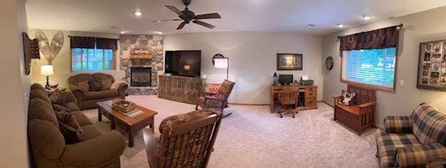 302 Peifer Dr, Litchfield, MN 55355 - living room with a ceiling fan, light carpet, a fireplace, recessed lighting, and healthy amount of natural light
