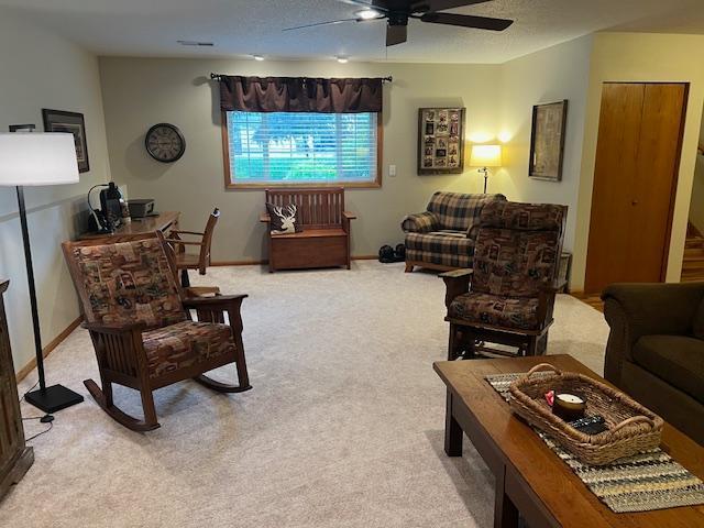 302 Peifer Dr, Litchfield, MN 55355 - living area featuring light colored carpet and a ceiling fan