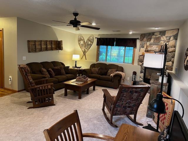 302 Peifer Dr, Litchfield, MN 55355 - living room with ceiling fan and light colored carpet