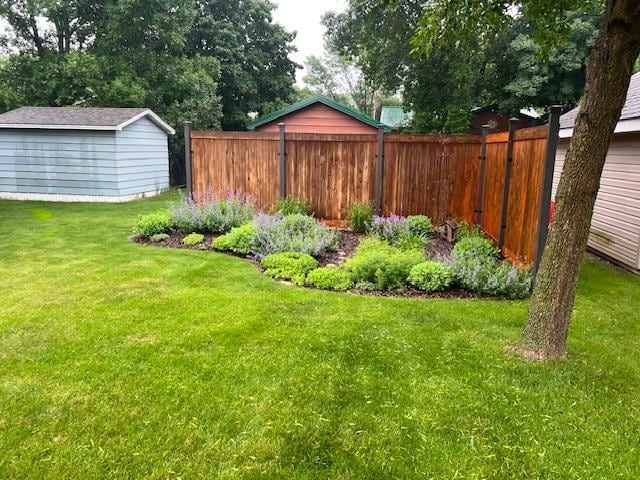 302 Peifer Dr, Litchfield, MN 55355 - view of yard with a storage unit