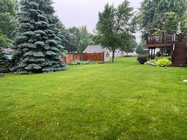 302 Peifer Dr, Litchfield, MN 55355 - view of yard featuring stairs and a deck
