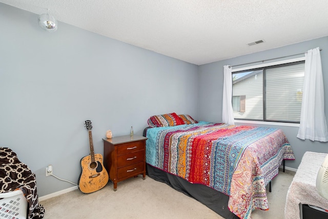 6668 84th Ct N, Brooklyn Park, MN 55445 - bedroom featuring light colored carpet and a textured ceiling