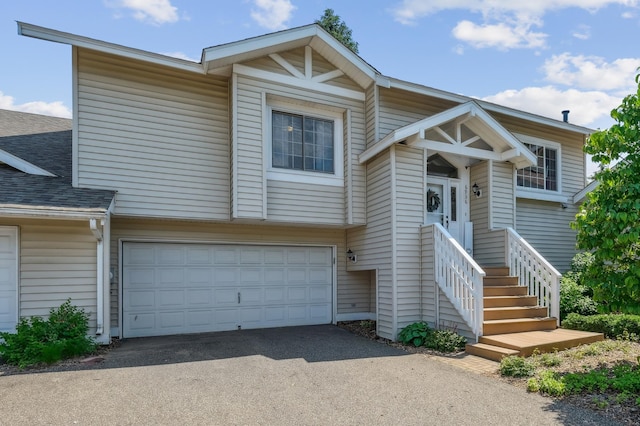 6936 Lake Ter E, Woodbury, MN 55125 - multi unit property featuring driveway, a shingled roof, and a garage