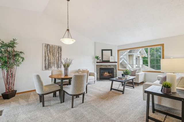 6936 Lake Ter E, Woodbury, MN 55125 - dining area with light colored carpet, a glass covered fireplace, and high vaulted ceiling