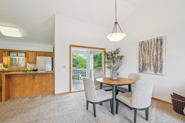 6936 Lake Ter E, Woodbury, MN 55125 - dining room featuring light carpet and high vaulted ceiling