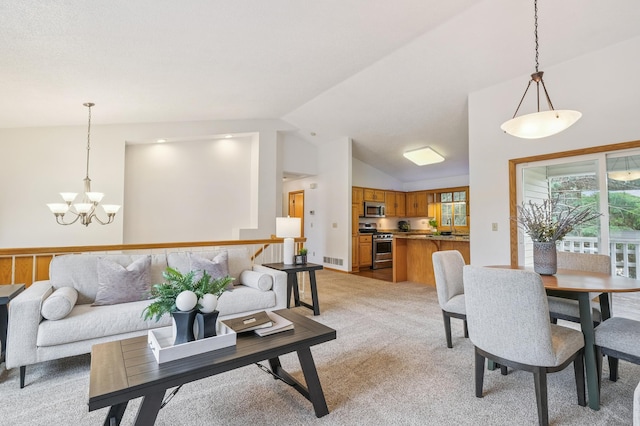 6936 Lake Ter E, Woodbury, MN 55125 - living area featuring light colored carpet, vaulted ceiling, and a chandelier