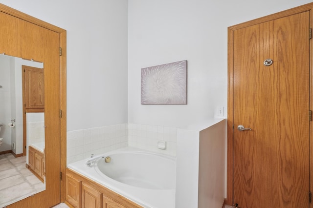 6936 Lake Ter E, Woodbury, MN 55125 - bathroom with a bath and toilet