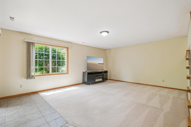 6936 Lake Ter E, Woodbury, MN 55125 - unfurnished living room featuring a fireplace, carpet floors, and a textured ceiling