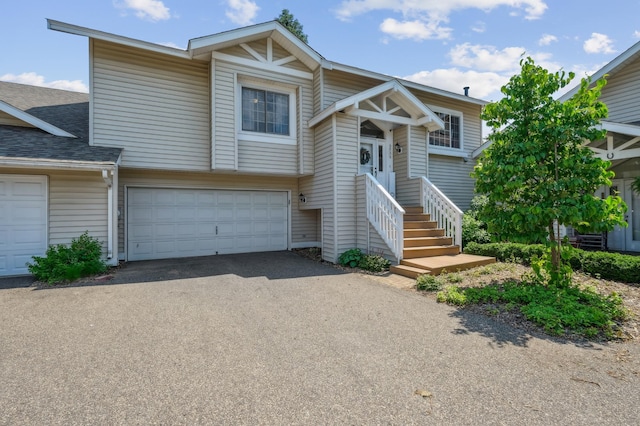 6936 Lake Ter E, Woodbury, MN 55125 - townhome / multi-family property with driveway, a garage, and roof with shingles