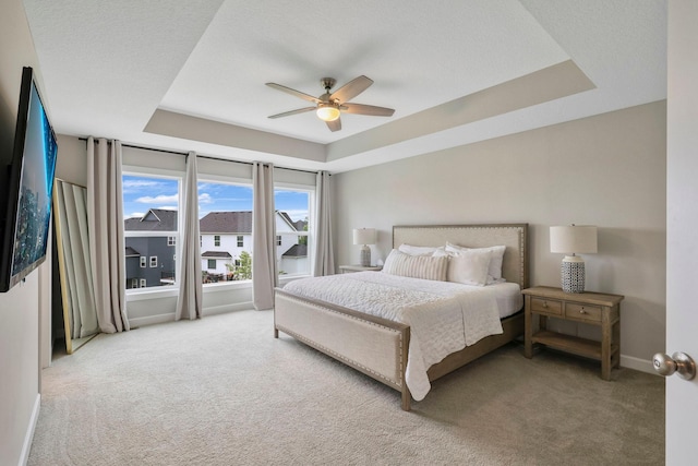 18175 61st Ave N, Plymouth, MN 55446 - carpeted bedroom with a raised ceiling and ceiling fan