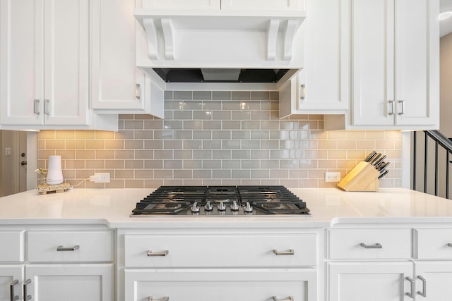 18175 61st Ave N, Plymouth, MN 55446 - kitchen featuring range hood, stainless steel gas cooktop, white cabinetry, light countertops, and backsplash
