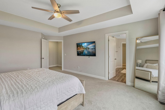 18175 61st Ave N, Plymouth, MN 55446 - carpeted bedroom featuring a ceiling fan and a tray ceiling