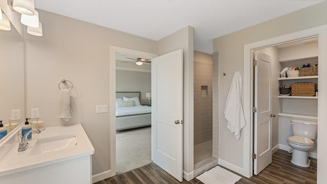 18175 61st Ave N, Plymouth, MN 55446 - full bath featuring wood finish floors, vanity, a tile shower, and ensuite bathroom
