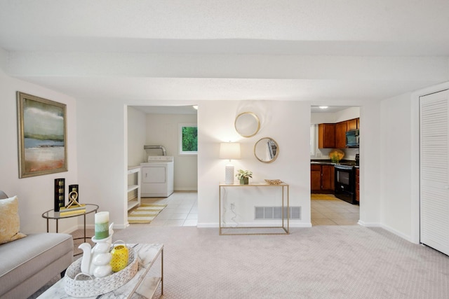 12908 Belle Aire Dr, Champlin, MN 55316 - living area with washer / dryer, light carpet, and light tile patterned floors