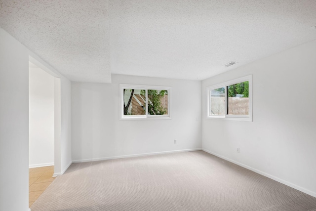 12908 Belle Aire Dr, Champlin, MN 55316 - unfurnished room featuring a textured ceiling and light colored carpet