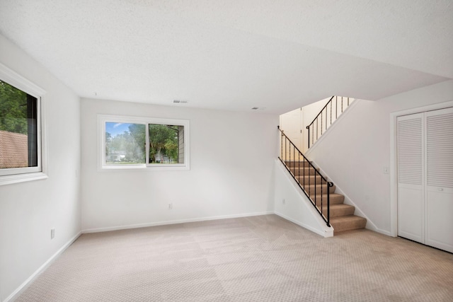 12908 Belle Aire Dr, Champlin, MN 55316 - unfurnished living room featuring carpet floors and stairs