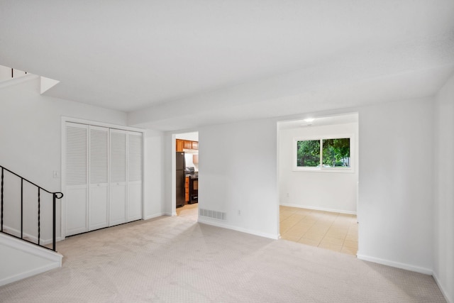 12908 Belle Aire Dr, Champlin, MN 55316 - unfurnished living room with stairs and light carpet