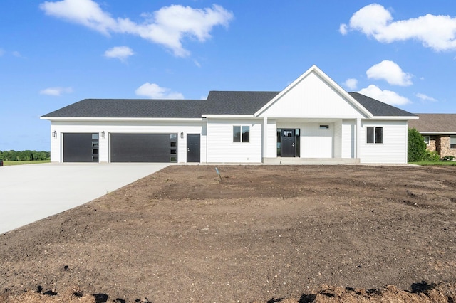 1720 Summer Ln NE, Alexandria, MN 56308 - view of front of property with a garage, driveway, and roof with shingles
