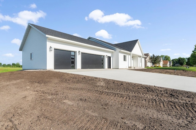 1720 Summer Ln NE, Alexandria, MN 56308 - view of home's exterior featuring a garage and concrete driveway