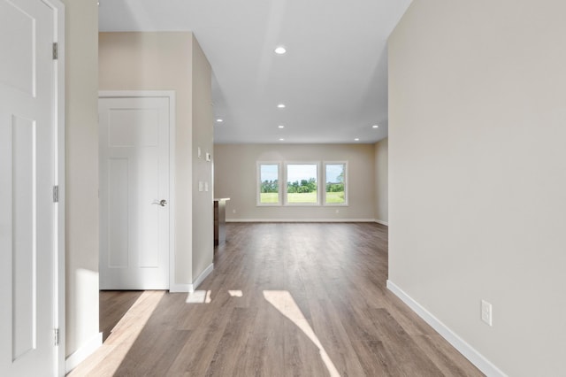 1720 Summer Ln NE, Alexandria, MN 56308 - unfurnished living room with wood finished floors and recessed lighting
