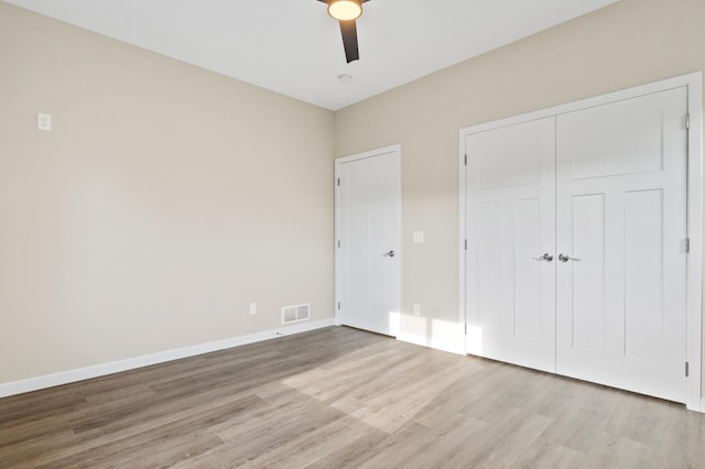 1720 Summer Ln NE, Alexandria, MN 56308 - unfurnished bedroom featuring light wood finished floors, a closet, and a ceiling fan