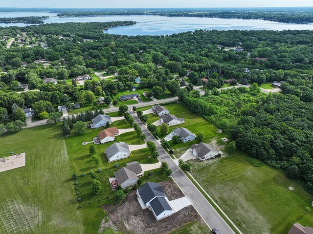 1720 Summer Ln NE, Alexandria, MN 56308 - aerial perspective of suburban area featuring a nearby body of water and a heavily wooded area