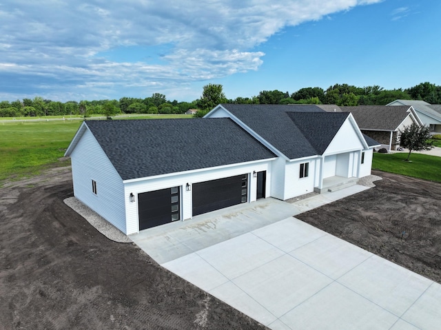 1720 Summer Ln NE, Alexandria, MN 56308 - view of front of home with a garage, roof with shingles, driveway, and a front lawn