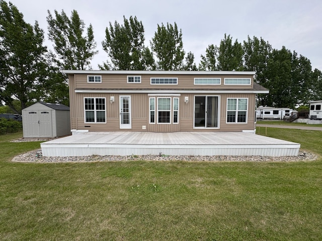 1540 US Highway 59 Unit 203, Detroit Lakes, MN 56501 - back of property featuring a storage shed, a lawn, and a wooden deck