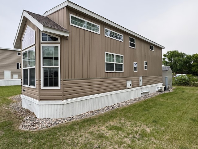 1540 US Highway 59 Unit 203, Detroit Lakes, MN 56501 - view of home's exterior featuring a yard and a cooling unit