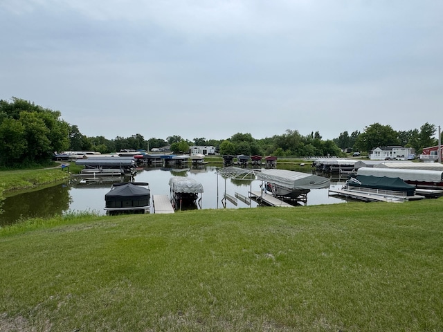 1540 US Highway 59 Unit 203, Detroit Lakes, MN 56501 - dock with a lawn, boat lift, and a water view