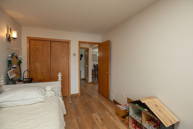 4887 Tee Ct SW, Rochester, MN 55902 - bedroom featuring wood finished floors and a closet